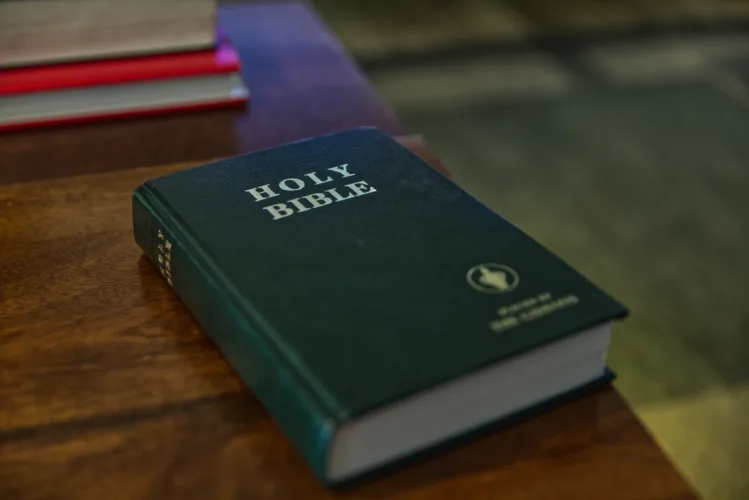 For over 100 years, travelers have checked into US motel rooms and found the Gideon Bible